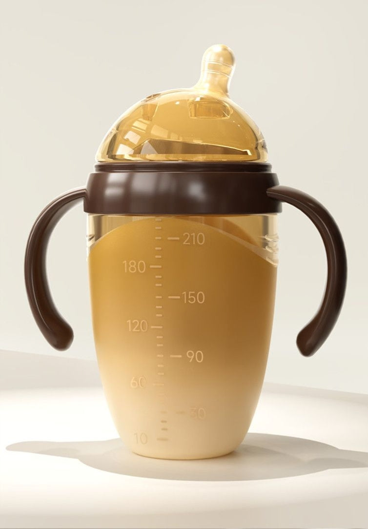 Soft and durable silicone baby bottle with a tilted spout and wide mouth, suitable for infants aged 0-6-12 months.